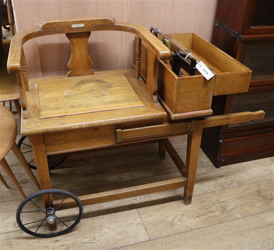 An early 20th century De Grave, Short & Co weighing seat W.97cm arms extended